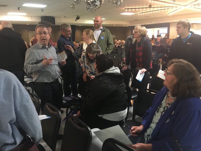 Representatives work to sway caucus goers